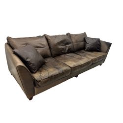 Collins & Hayes - contemporary grande three-seater sofa upholstered in brown leather, with curved arms and standing on tapering feet