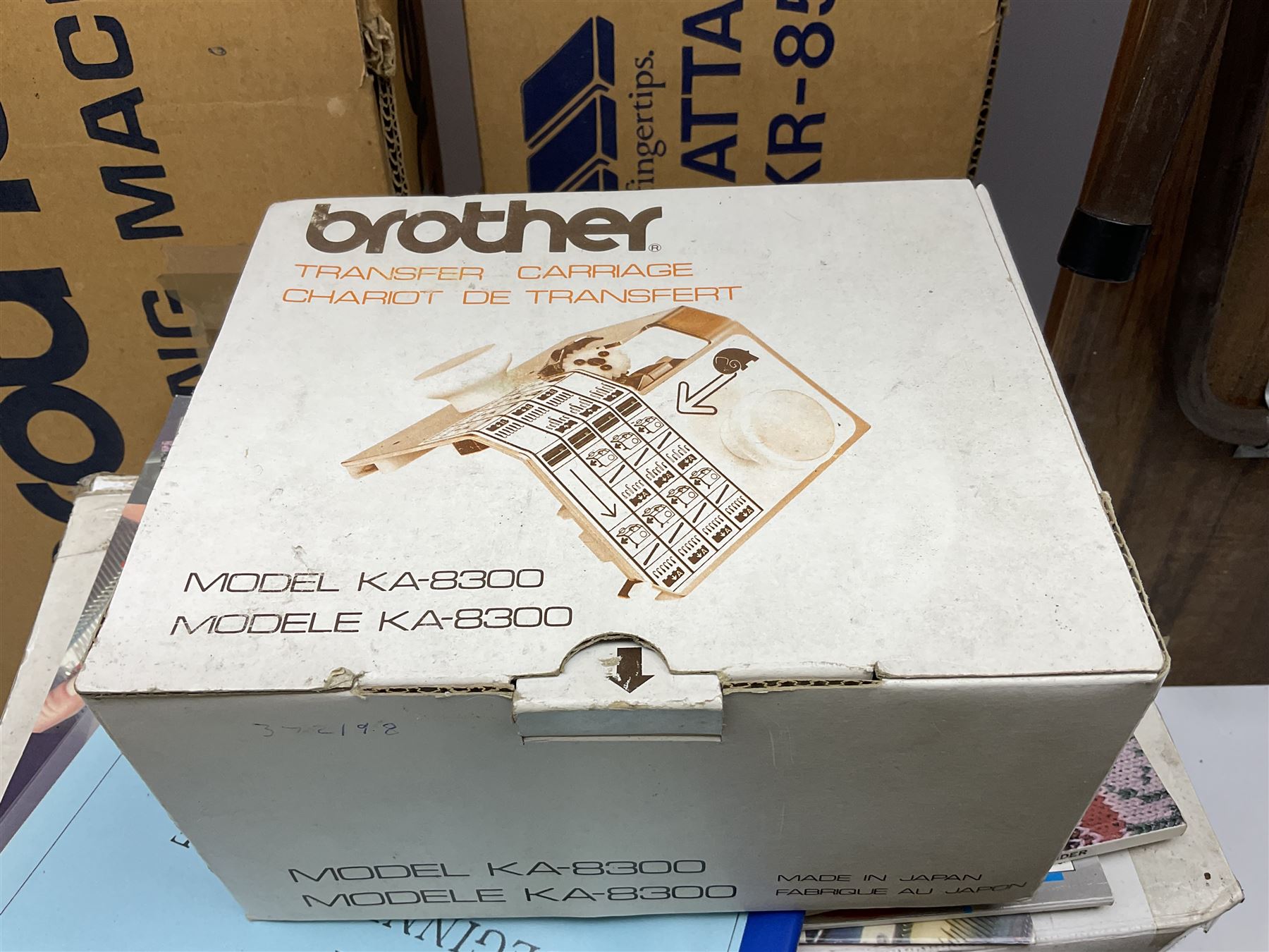 Brother knitting machine model KH-881, ribbing attachment model KR-850 and cone winder, all boxed