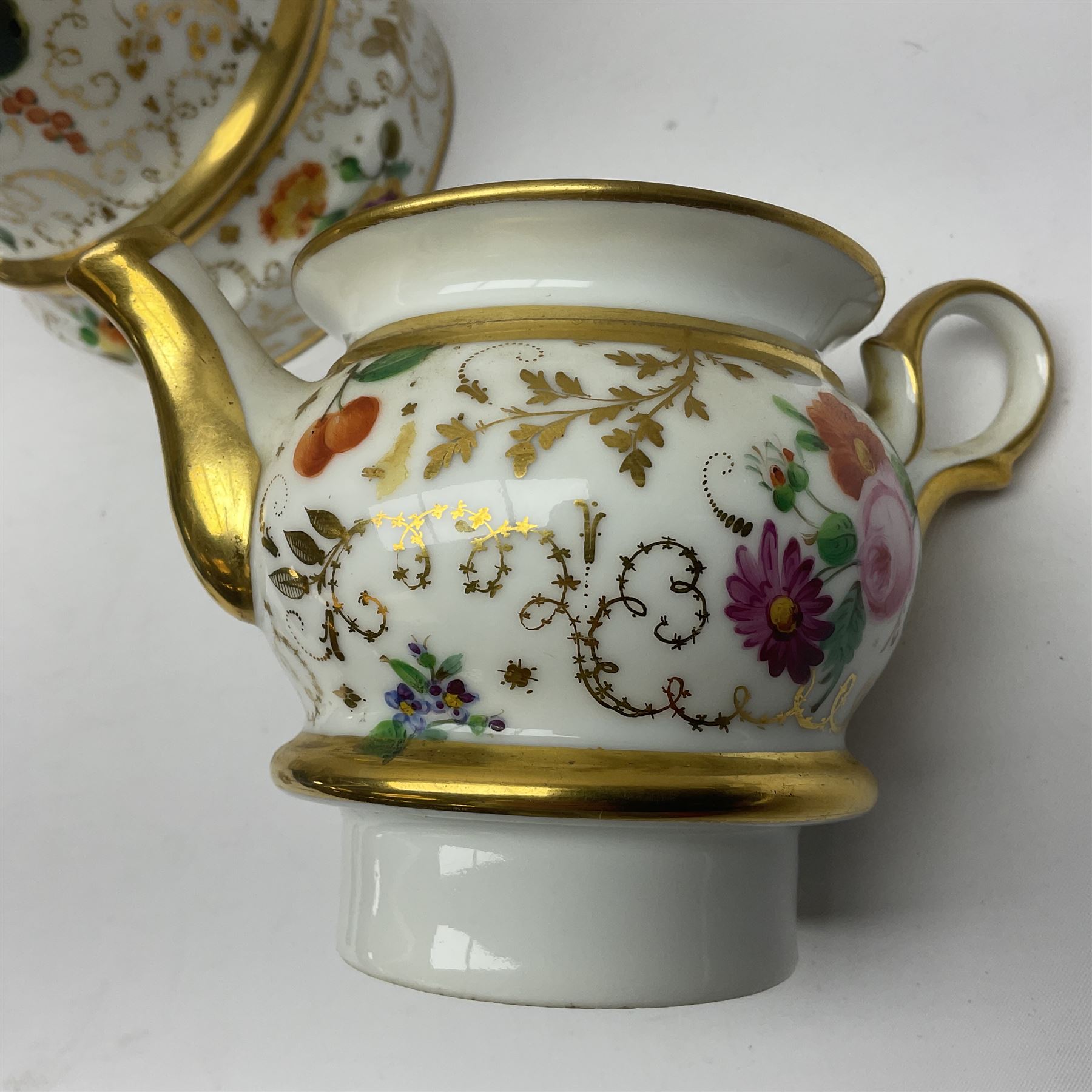 Two 19th century continental teapots and warmers, each teapot upon a cylindrical warming base, hand printed with floral sprigs, birds and insects, largest H22cm 