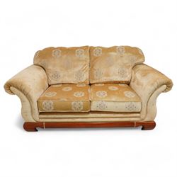 Three-seat sofa (W197cm, D103cm) and pair of matching armchairs (W100cm); upholstered in pale gold fabric decorated with Gul motifs, hardwood framed with polished base