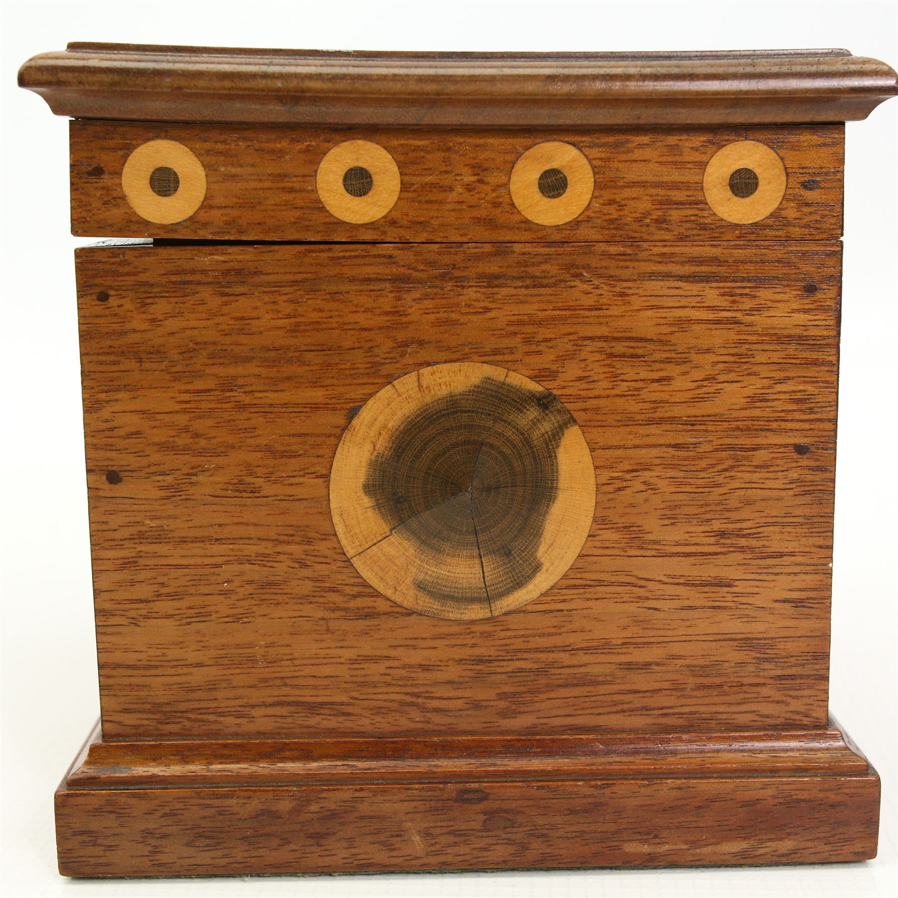 E Dommett - Early 20th century mahogany box, the hinged lid inlaid with laburnum heart above a frieze inlaid with roundels in laburnum and holly, the interior of the lid in olive wood and the base lined with holly, signed 16cm x 12cm x 13cm and with a hand written note identifying the woods used.