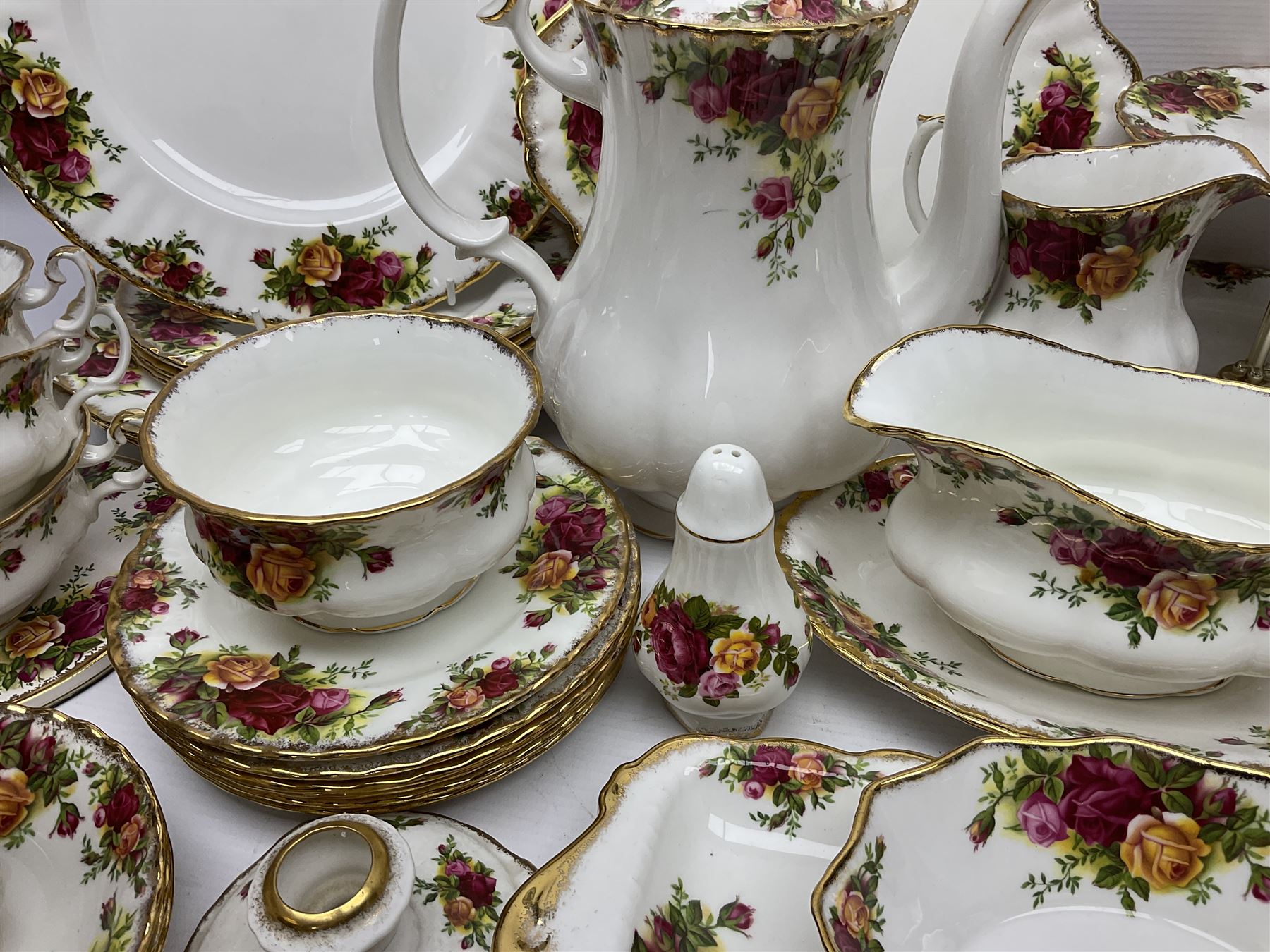 Royal Albert Old Country Roses pattern coffee service for six, comprising coffee pot, milk jug, cups and saucers, cake plate, together with miniature teapot, six teacups and saucers, six dinner plates, six side plates etc 