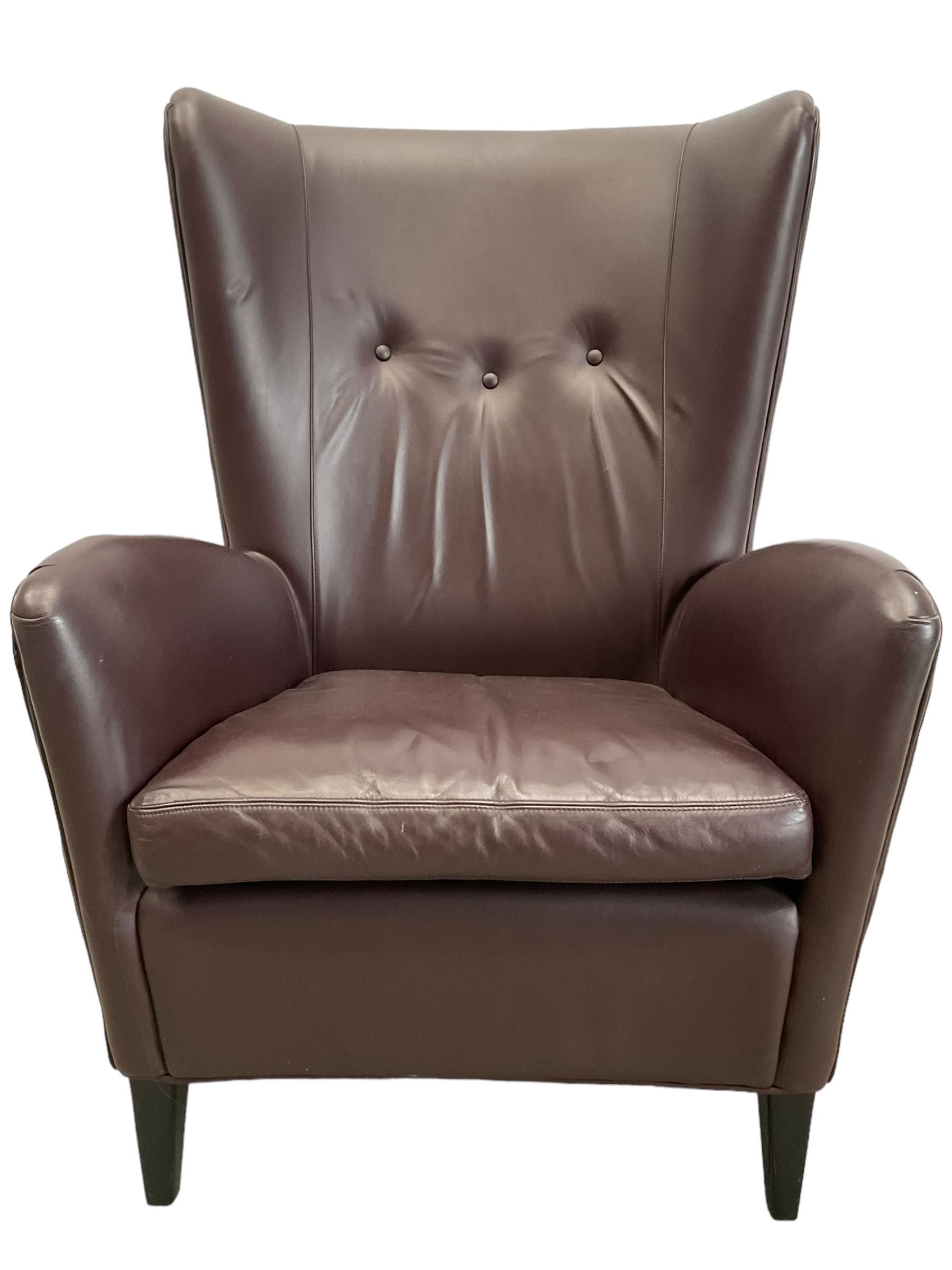 Wing back armchair upholstered in cocoa brown leather