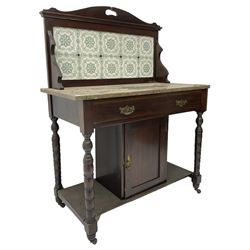 Edwardian walnut washstand, raised tiled back over marble table, fitted with single long drawer over panelled cupboard, on collar turned supports, brass and ceramic castors