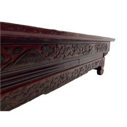 Mid-19th century Qing dynasty opium or wedding bed, Zhejiang province, rectangular top with weave cane work, the frieze rail carved with trailing leafy branches and flower heads, over moulded rail with small drawer, shaped base carved with further tailing foliate decoration terminating to shaped feet, united by stretchers 