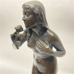 Bronze nude female figure holding a rose, upon a stone plinth, H40cm 