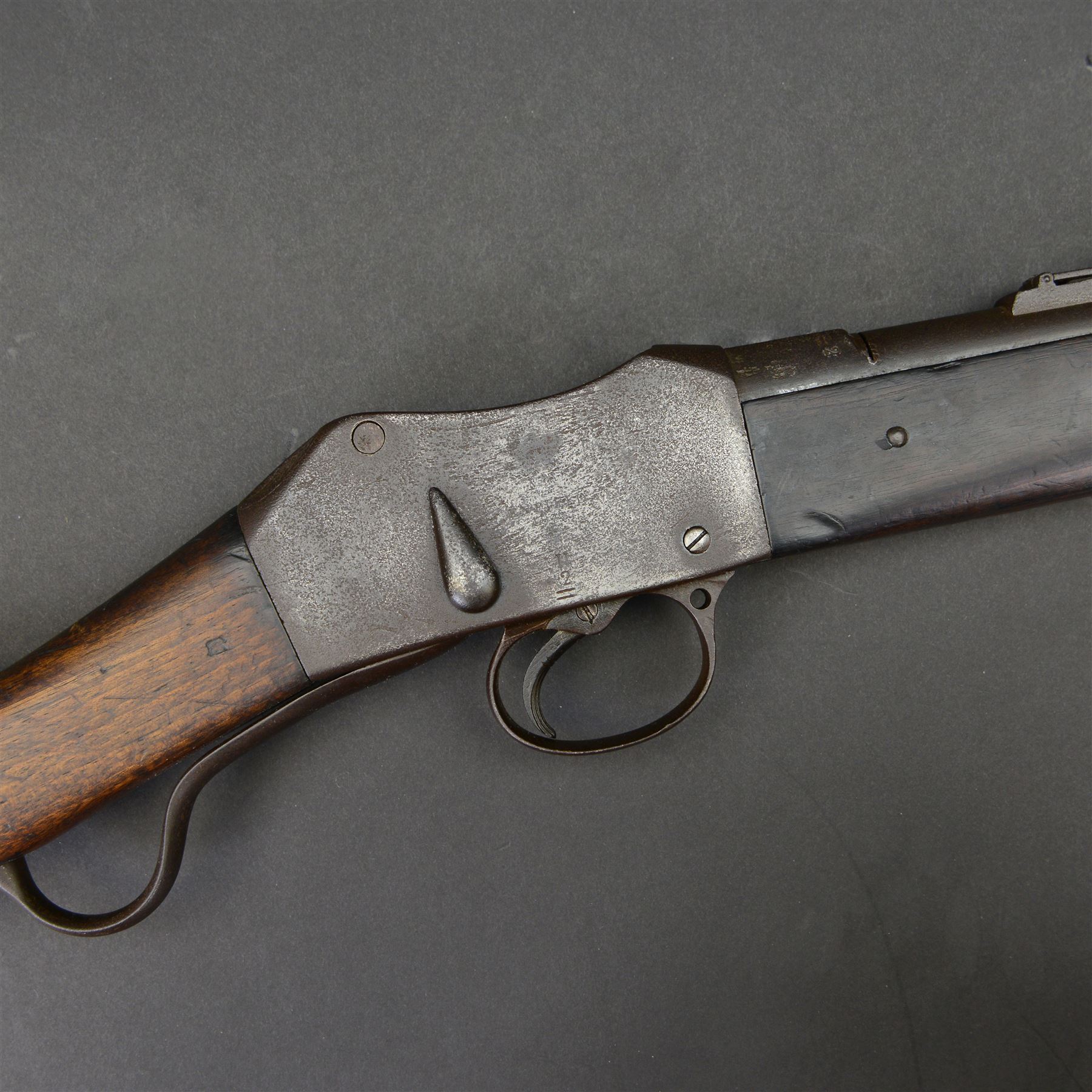 Martini-Henry MKII/2 Carbine, the 52cm round barrel with various inspectors marks,   fitted with ladder sight, with various inspector's marks, the action marked Enfield, the walnut full stock with two steel barrel bands, the butt inset with brass roundel stamped' 12 1893 V 1 GR. A 6', and with Sold Out of Service arrows to the butt, action and barrel, steel cleaning rod beneath, overall 96cm
Sold as an exempt item under Section 58 (2) of the 1968 Firearms Act, to be held as a curiosity or ornament


