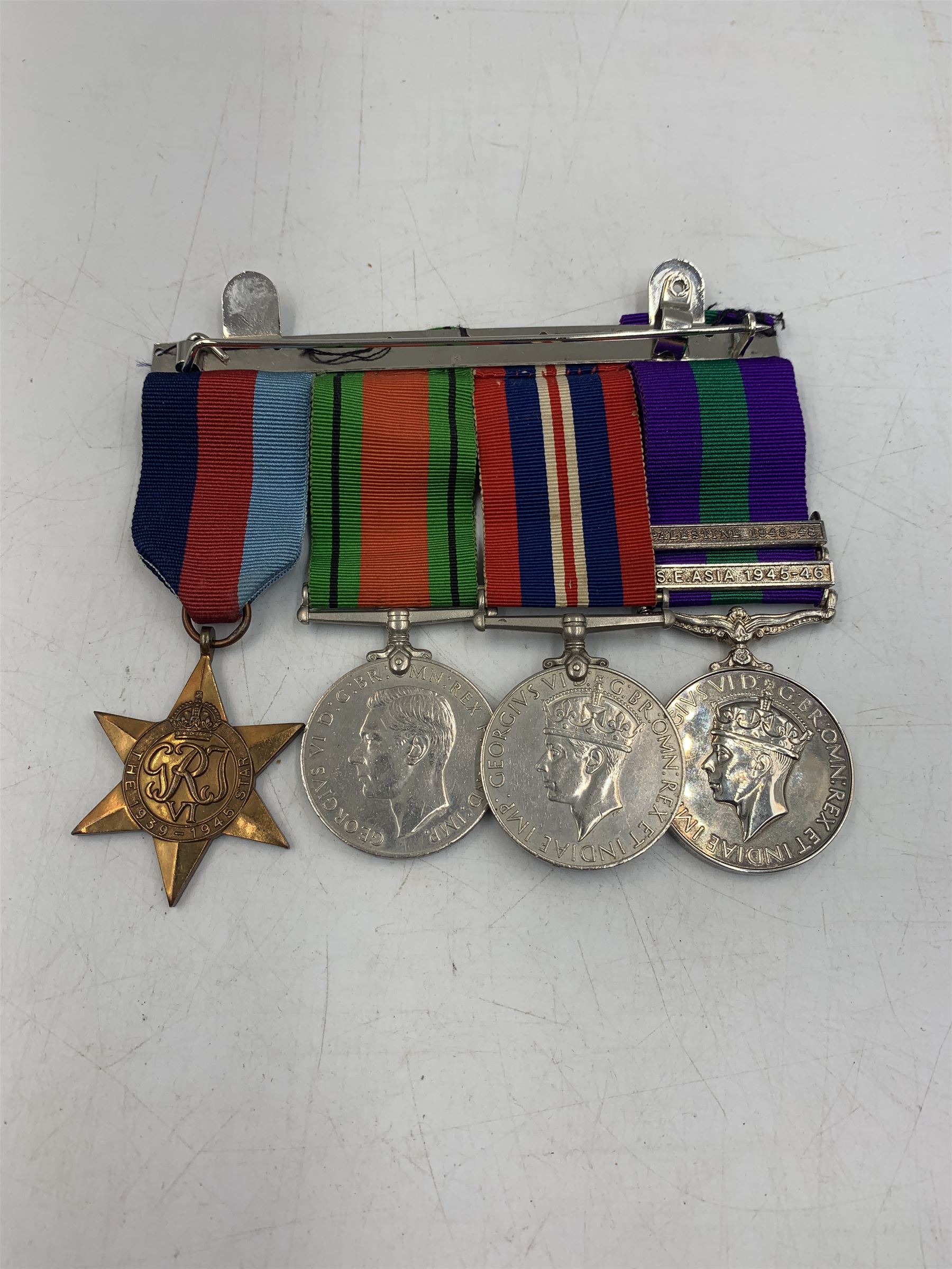 1939-1945 Star, 1939-1945 Defence Medal, 1939-1945 War Medal, Copy General Service Medal with Palestine 1945-48 and S.E Asia 1945-46 bars and a Copy South Atlantic Medal, with ribbons