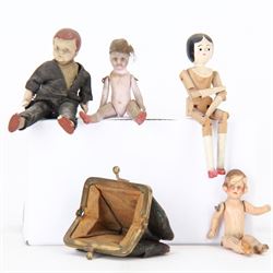 Four miniature dolls with articulated limbs, and a miniature purse