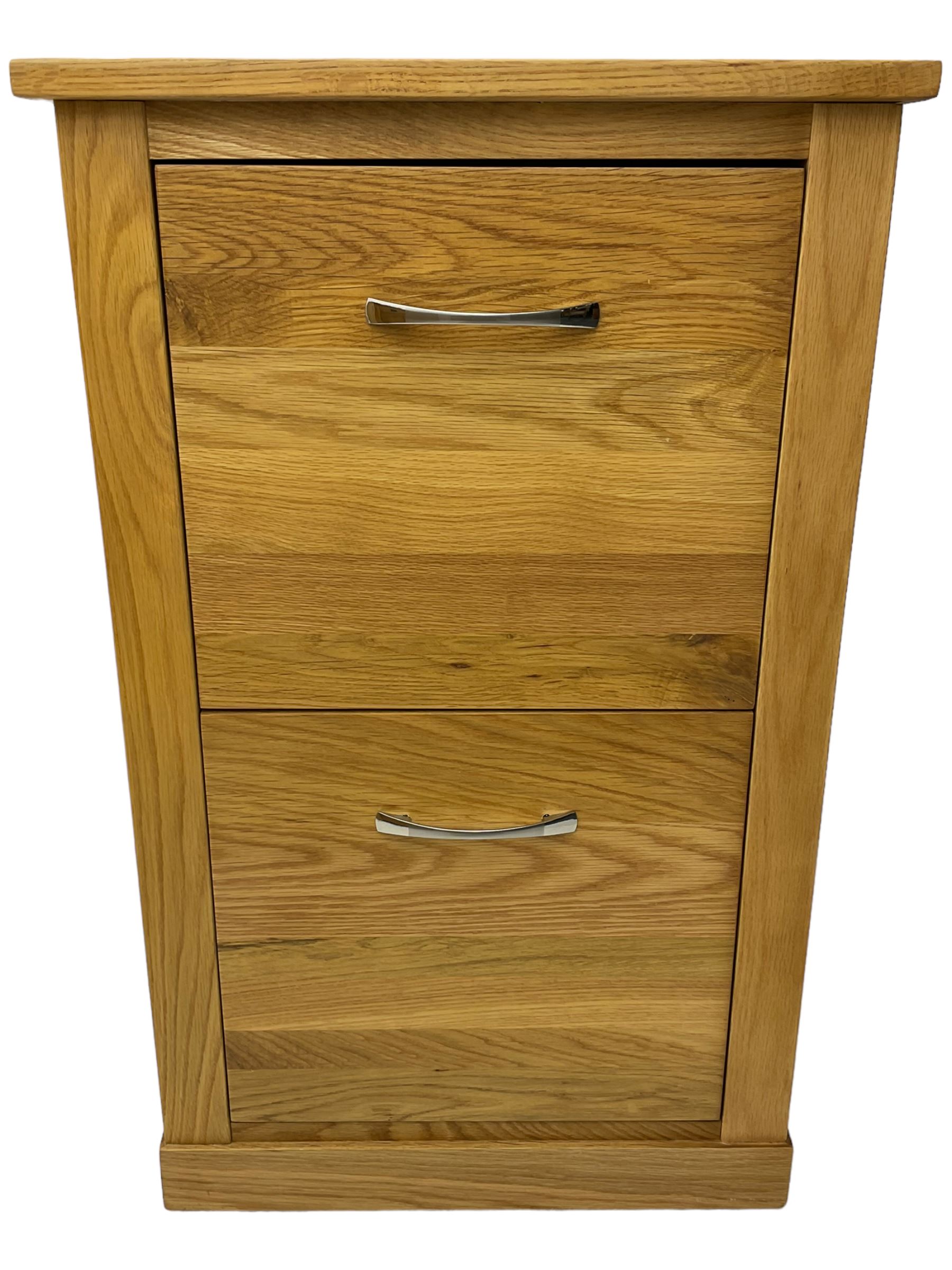 Contemporary light oak filing cabinet, rectangular top over two drawers each fitted with metal rods, on plinth base