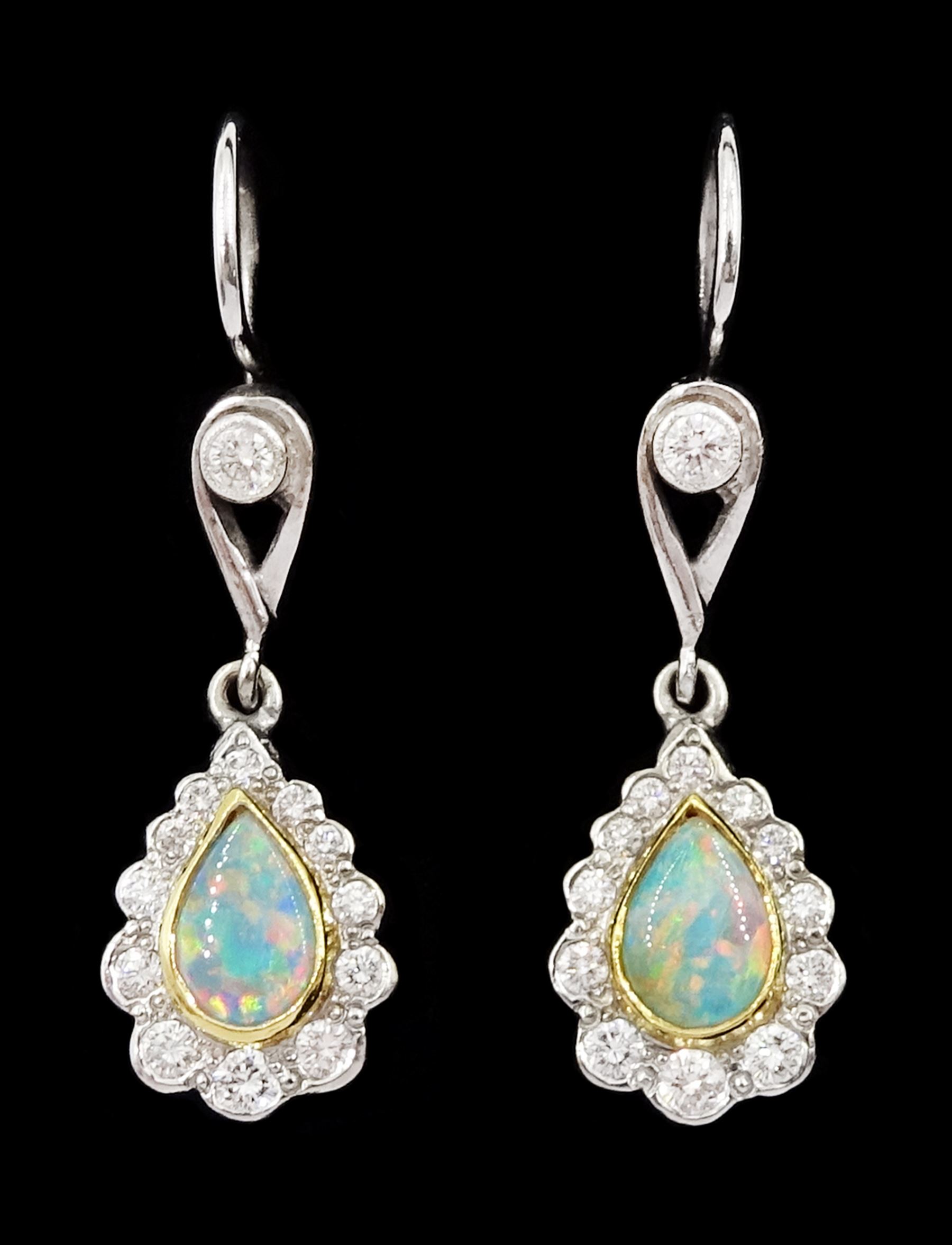 Pair of 18ct gold opal and diamond pendant stud earrings, pear cut opal and round brilliant cut diamond cluster, suspending from a milgrain set single stone diamond