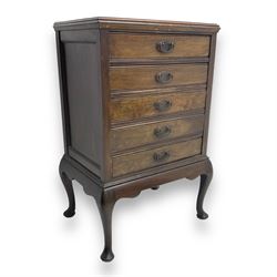 Early 20th century mahogany music cabinet, moulded rectangular top over five hinged fall-f...