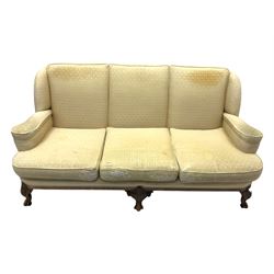 Late 20th century mahogany framed three seat sofa, upholstered in cream fabric with repeating cross pattern, raised on cabriole supports (W192cm, D98cm, H89cm); matching armchair in light pink fabric (W92cm, D98cm, H89cm) 