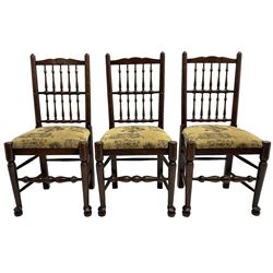 Set of six (4+2) 20th century oak spindle back dining chairs, with upholstered drop-on seat cushions, turned supports joined by turned stretchers