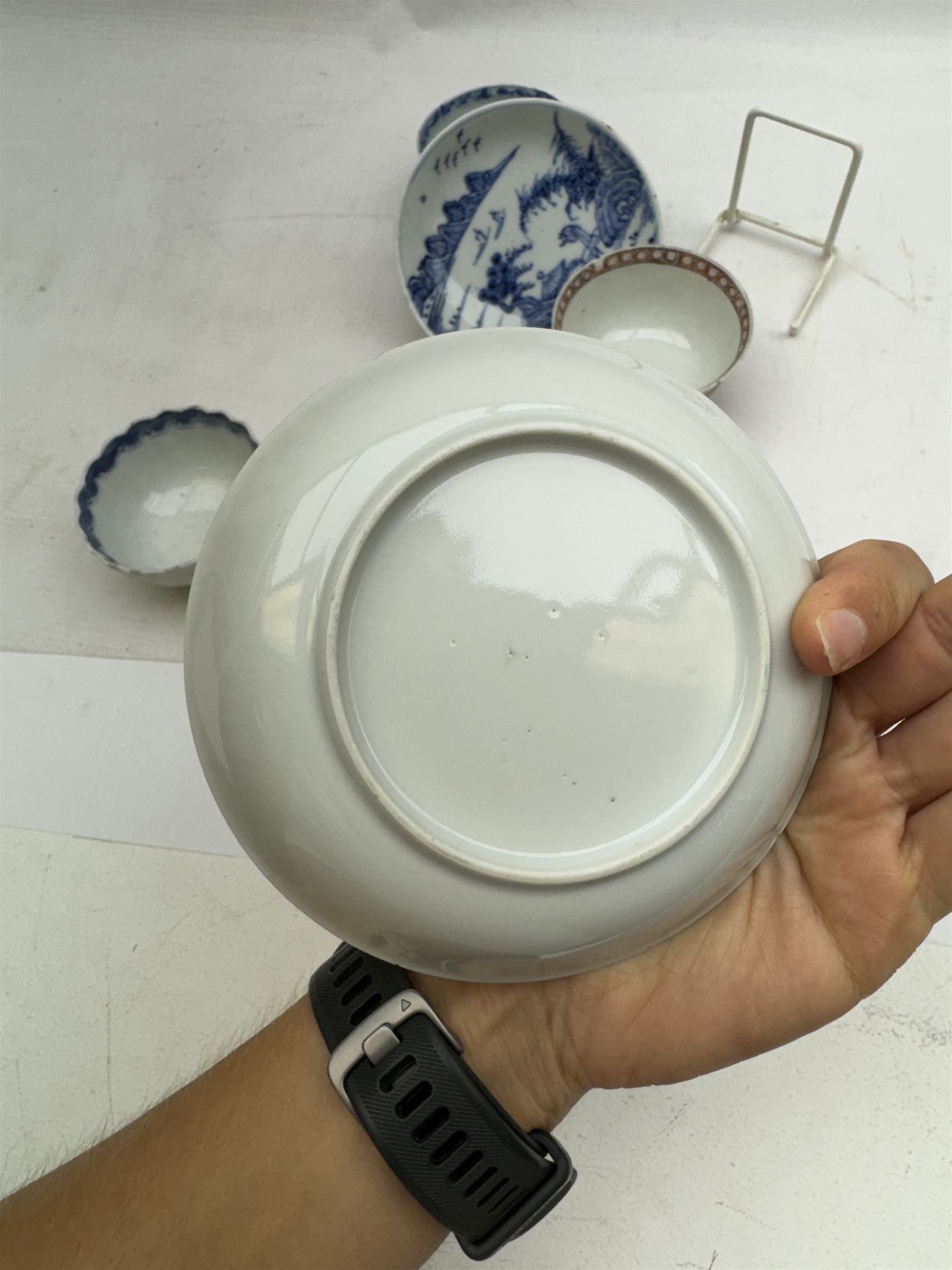 19th Century Chinese tea bowl and saucer, decorated with figures in a garden scene, together with tow other tea bowls and a saucer 