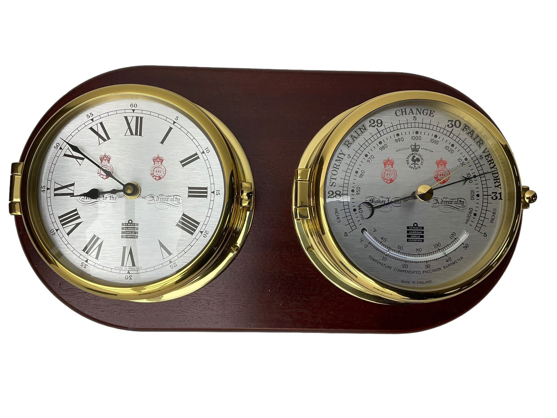 Sewell's - 20th century matching compendium aneroid barometer and quartz clock on a mahogany board,