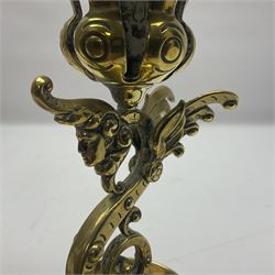 Pair of Victorian brass candlesticks by Adolf Frankau & Co, each with pierced sconce upon a scrolling stem with winged mask decoration, the lobed drip pan embossed with masks and upon three scrolling feet, stamped with maker's mark beneath, H18cm