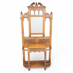 Late Victorian walnut hallstand, scrolled pediment with central finial over rectangular be...