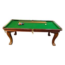 Riley - mahogany slate bed snooker dining table, green baize playing surface fitted with leather net pockets, raised on cabriole supports ending in ball and claw feet; together with set of Riley cues, balls and scoreboard