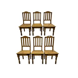 Set of six waxed pine dining chairs, shaped cresting over vertical slat back, plank seat o...