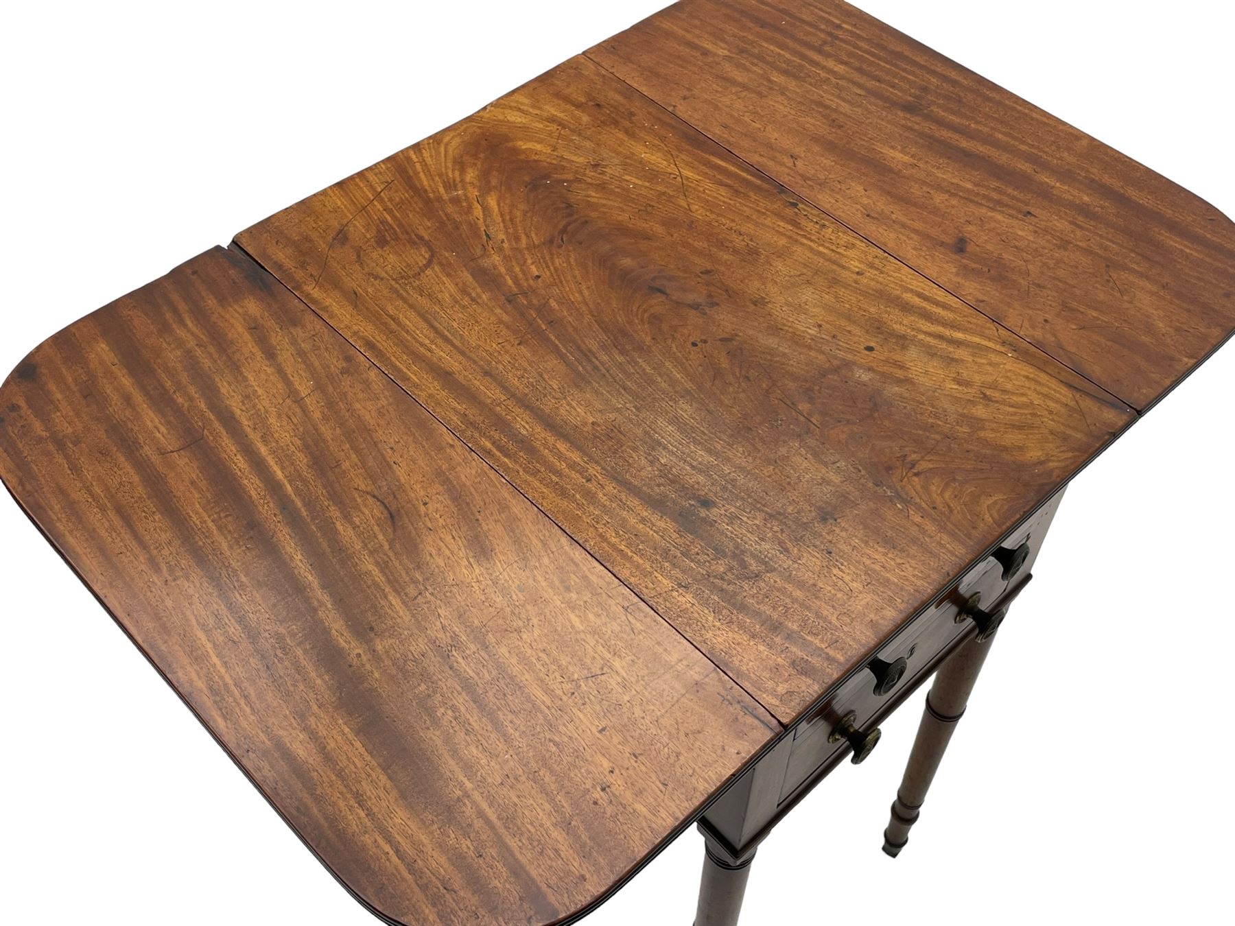 George III mahogany Pembroke table, reed moulded rectangular drop leaf top with rounded corners, fitted with two drawers opposing two false drawers, on ring turned supports with brass cups and castors 