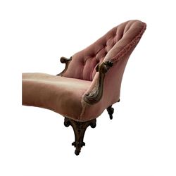 Victorian walnut framed tete-a-tete loveseat, scrolled arm terminals with moulded foliate decoration, buttoned backs and sprung seat upholstered in pale pink velvet, raised on cabriole supports with applied flower heads and scroll feet terminating to ceramic castors