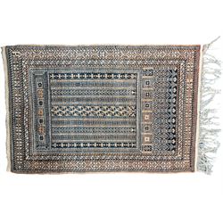 Bokhara rust ground rug, decorated with two rows of Gul motifs (175cm x 113cm); Persian design rug, the busy field decorated with geometric patterned stripes (144cm x 94cm)