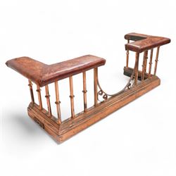 Victorian copper club fender, leather upholstered cushioned seats on turned balustrade supports, drop centre with C-scroll corner brackets, on stepped moulded curb 