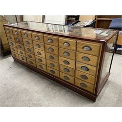 20th century mahogany and glazed haberdashery shop's display cabinet, fitted with thirty-five small drawers, on skirted base  - THIS LOT IS TO BE COLLECTED BY APPOINTMENT FROM THE OLD BUFFER DEPOT, MELBOURNE PLACE, SOWERBY, THIRSK, YO7 1QY