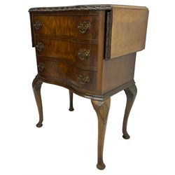 Early to mid-20th century figured walnut lamp table, shaped drop-leaf top with foliate carved edge, fitted with three drawers, on shell carved cabriole supports