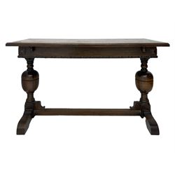 Early 20th century oak extending table, moulded rectangular top, pull-out action with fold-out leaf, on turned cup and cover pedestals and sledge feet, united by moulded stretcher 