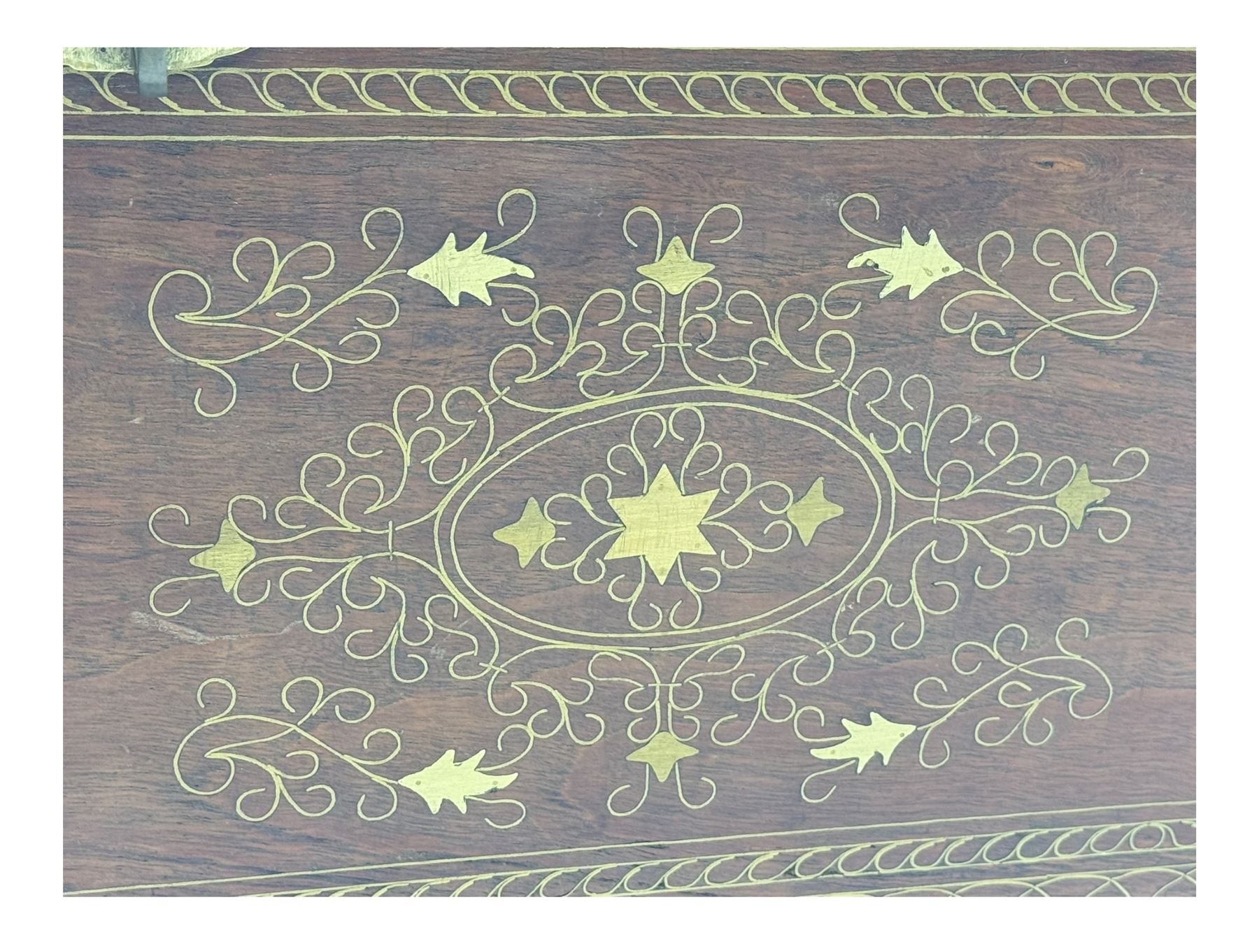 20th century mahogany chest, rectangular hinged top enclosing removable compartments with carved starburst motifs with linear and geometric patterns, brass inlay to the top and front, mounted corners and edges, on bracket base