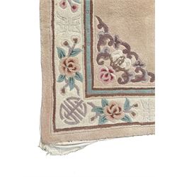 Chinese washed woollen rug, decorated with flowers and Chinese symbols 