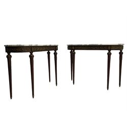 Pair of late 20th century French design mahogany console tables, D-end form with white and grey veined marble tops, the frieze rails decorated with scrolled leaf and flower head cast brass mounts, on turned and fluted supports with cast brass mounts and feet 