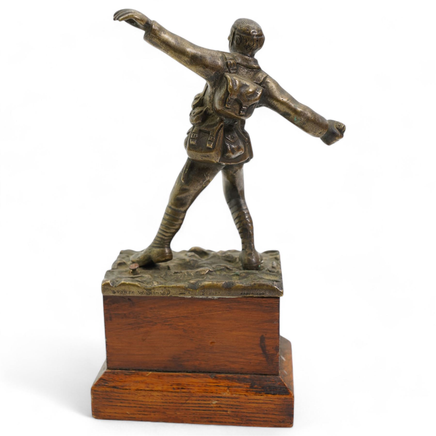 Sydney Wilkinson - bronze of a WWI soldier in the act of throwing a hand grenade, signed and on pine base H19cm 