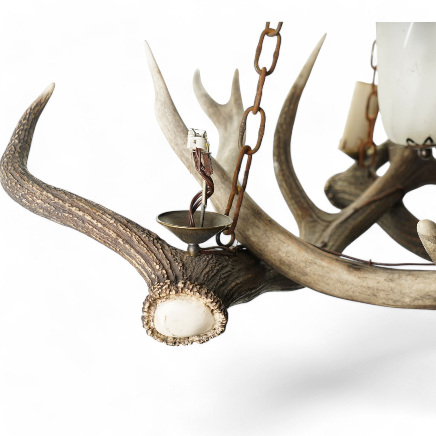 Deer antler chandelier, of triangular form, with four fitted lights H76cm