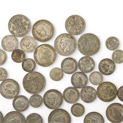 Approximately 610 grams of Great British pre 1947 silver coins, including sixpences, shillings, two shillings or florins, halfcrowns etc