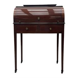 Edwardian inlaid mahogany roll-top desk, cylindrical lid enclosing fitted interior with pigeonholes, drawers and retractable writing surface, over two drawers with brass pull handles, on tapered supports with brass and ceramic castors