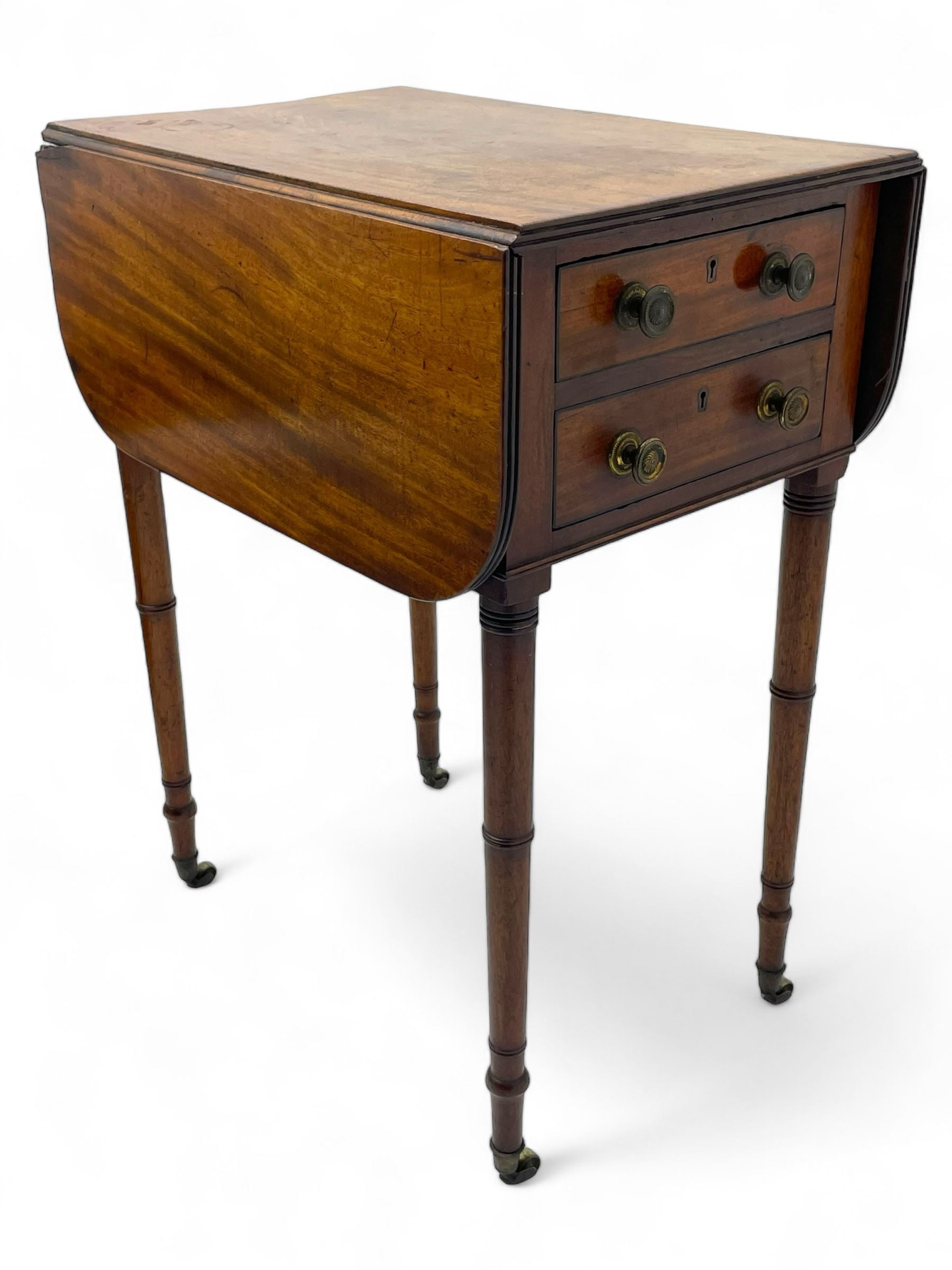 George III mahogany Pembroke table, reed moulded rectangular drop leaf top with rounded corners, fitted with two drawers opposing two false drawers, on ring turned supports with brass cups and castors 