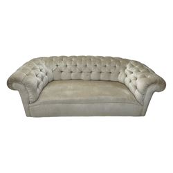 Chesterfield shaped button-tufted sofa, upholstered in pale beige velvet fabric with rolled arms, decorative rope trim and ruched detailing