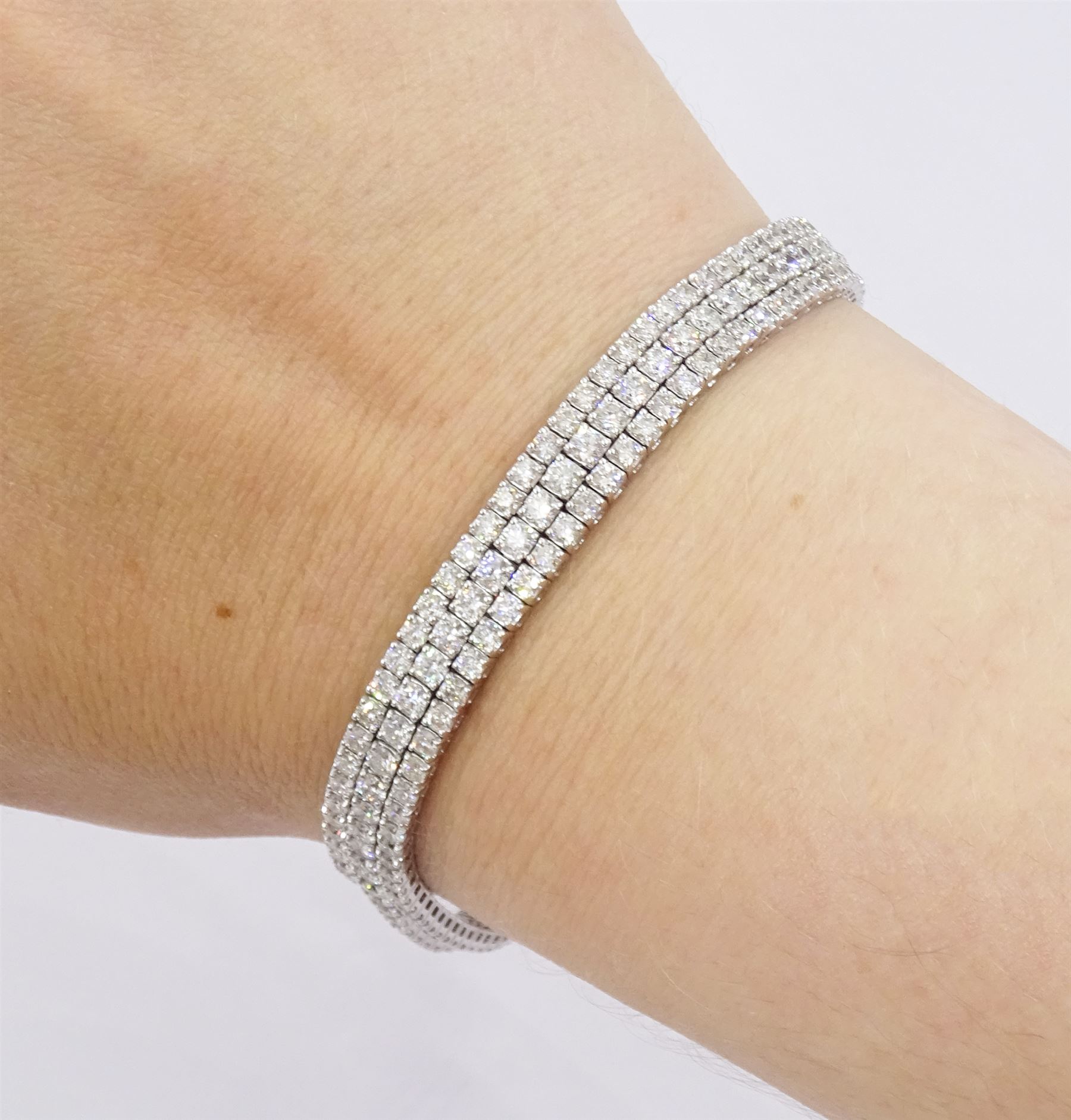 18ct white gold three row round brilliant cut diamond bracelet, stamped, total diamond weight approx 7.70 carat