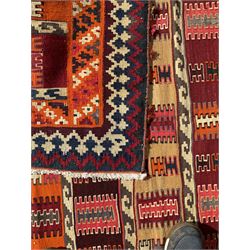 Southwest Persian Qashqai Kilim ground rug, featuring a series of horizontal striped panels each filled with intricate geometric designs, enclosed by a dark blue and ivory border with stylised star and zigzag motifs