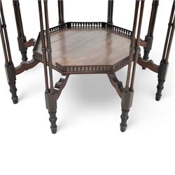 Late 19th to early 20th century mahogany octagonal centre table, moulded top over pierced arcade frieze rails and fretwork brackets, on eight cluster column supports terminating to turned feet, united by under tier with raised gallery 