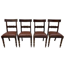 Set of six (4+2) early 19th century mahogany dining chairs, figured bar back over rose and curled leaf carved middle rail, drop-in seats upholstered in brown fabric, on turned front supports 