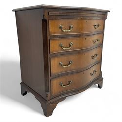 Georgian design mahogany serpentine chest, fitted with slide above four graduating drawers...