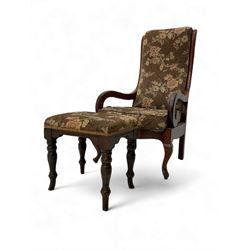 Early 20th century mahogany open armchair, upholstered in pink floral fabric on a brown gr...