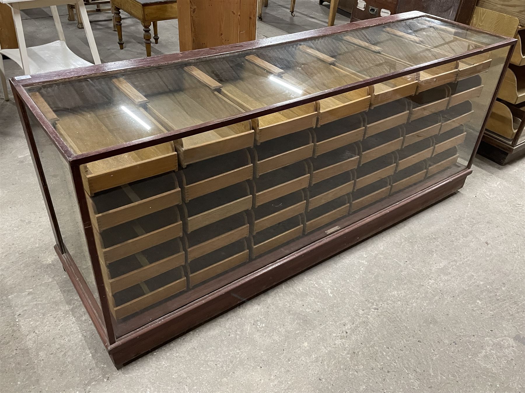 20th century mahogany and glazed haberdashery shop's display cabinet, fitted with thirty-five small drawers, on skirted base  - THIS LOT IS TO BE COLLECTED BY APPOINTMENT FROM THE OLD BUFFER DEPOT, MELBOURNE PLACE, SOWERBY, THIRSK, YO7 1QY