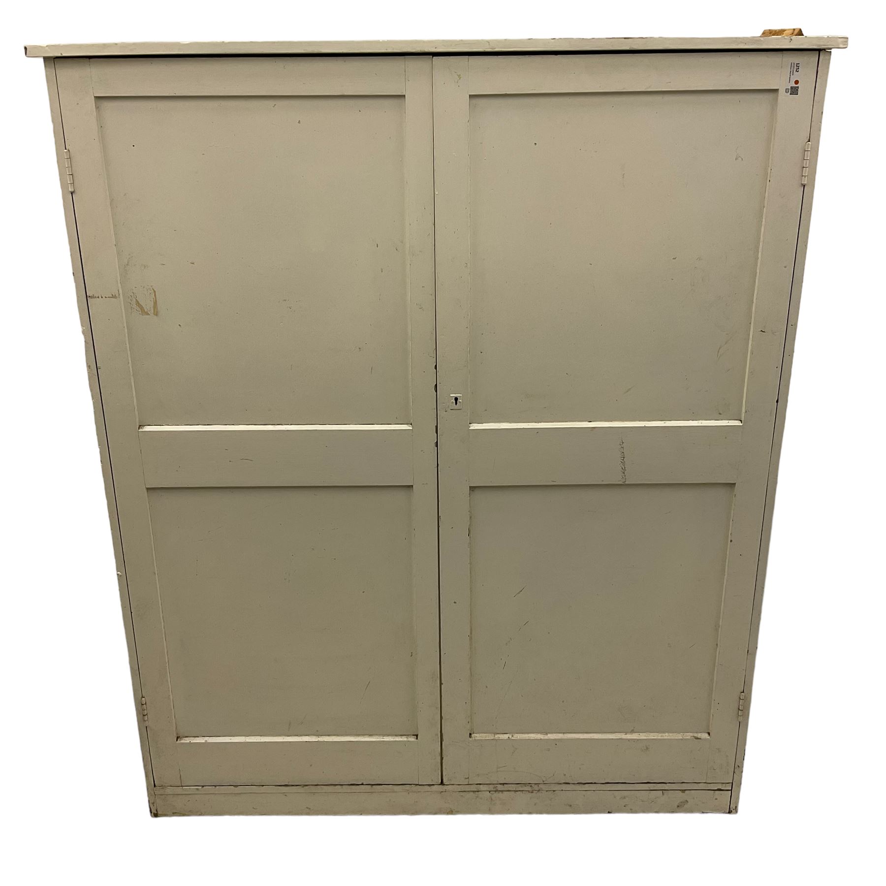 Large Victorian white painted pine cupboard, enclosed by two panelled doors 