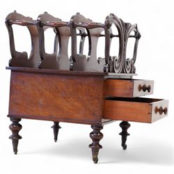 Victorian mahogany Canterbury, three divisions, carved with scrolls and curled leaf motifs, fitted with two drawers, on turned feet with brass cups and castors 