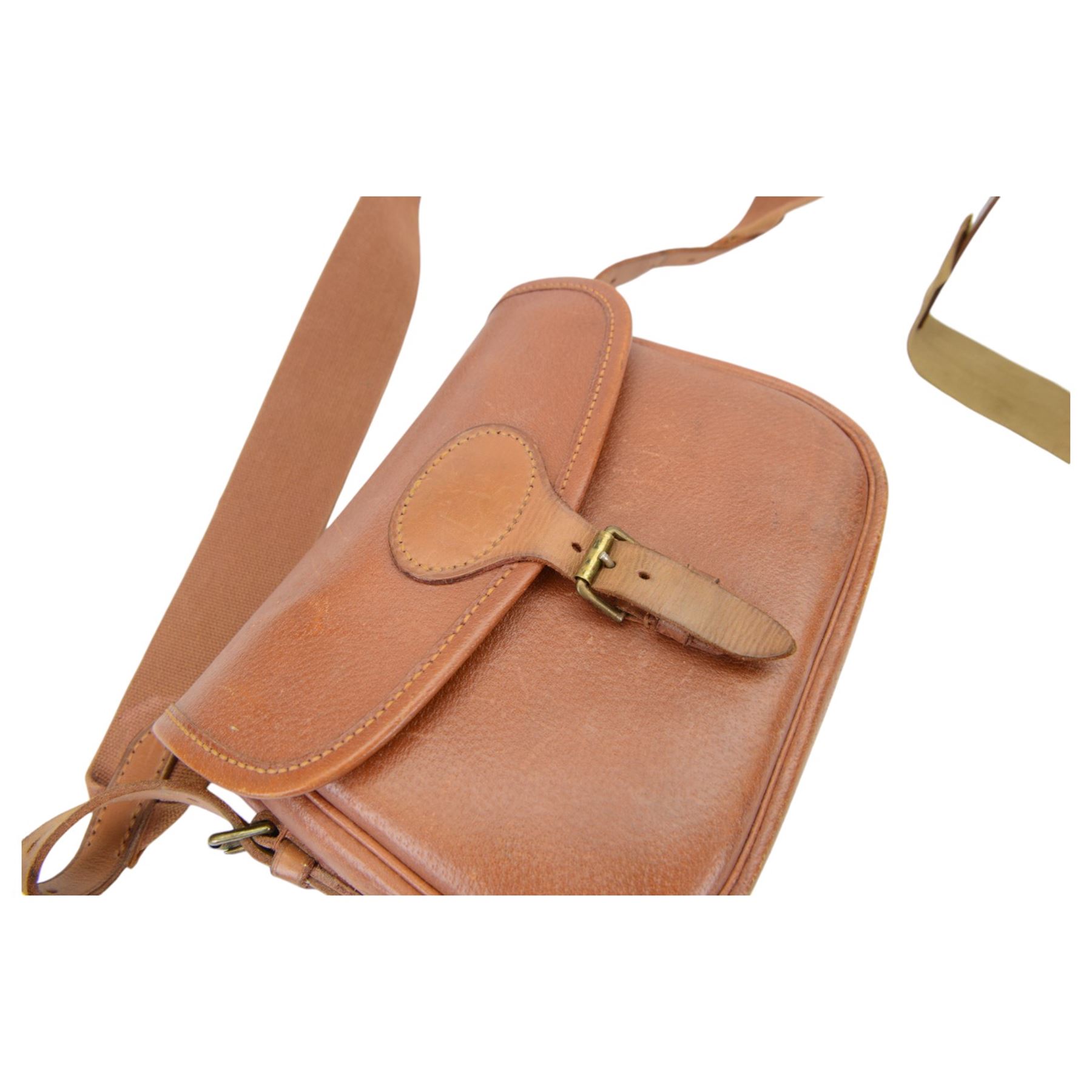 Brady brown leather cartridge bag on a canvas strap, together with another cartridge bog with a Croots leather and canvas strap